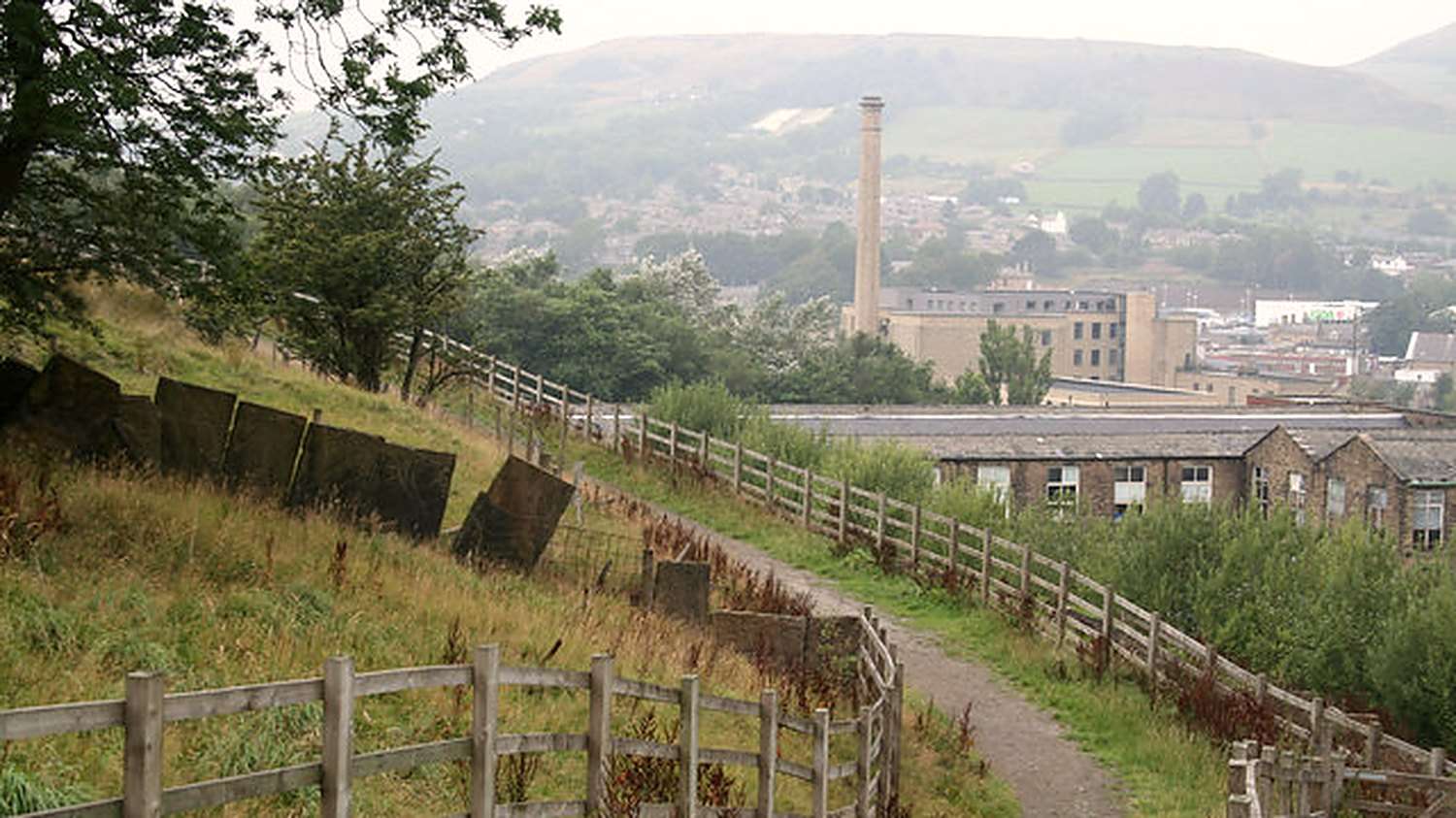 A stone mill and chimney in the Rossendale valley